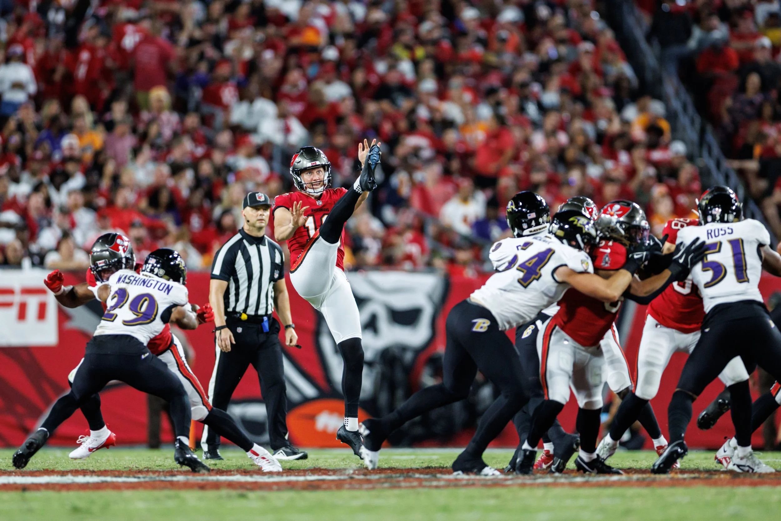 Football game with players in action on the field